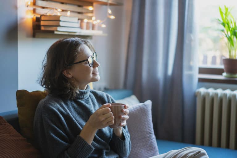 young woman in cosy well heated home