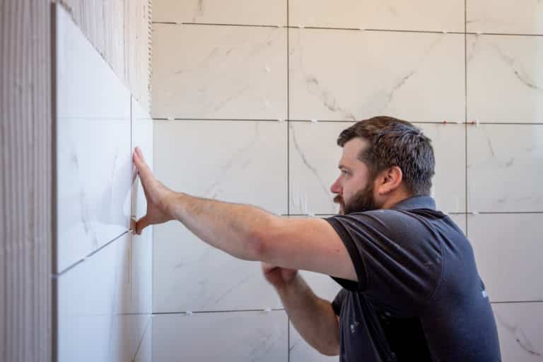 Fitting tiles in bathroom